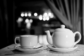 English tea in a cafe / cup and kettle with five o'clock tea