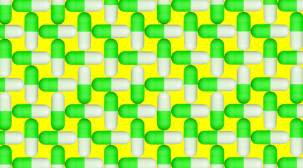 white and green pills on yellow background pattern