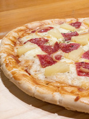 artisan pizza with sausage and pineapple