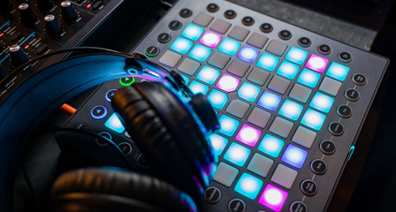 Fototapeta na wymiar Professional hi-fi dj headphones on sound mixer controller. Moscow