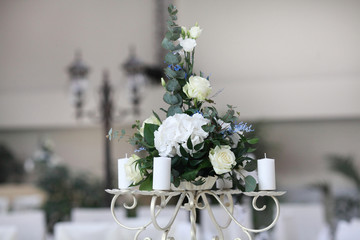luxury wedding decorations with bench, candle and flowers composition on ceremony place
