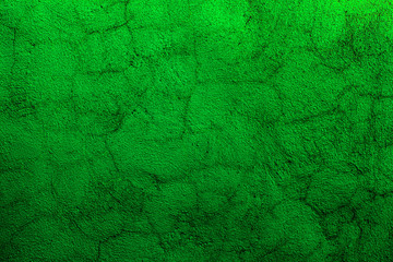 Green colored abstract wall background with textures of shades of green