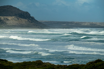 Fototapeta na wymiar raging ocean with large white waves in the region of the cape of good hope in the south african republic