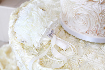 this is a very cool wedding cake with sugar ribbons on top