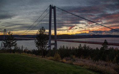 Fototapeta premium Sweden. Large anchor bridge over the sea against the sunset sky