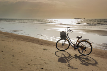 Bicycle parked on Thap Sakae beach Prachuap Khiri Khan, Thailand