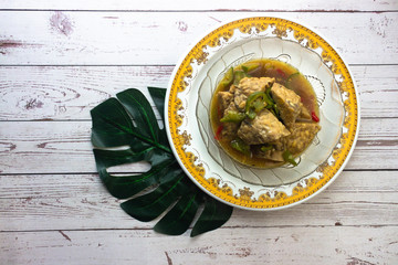 Opor Tempe is Indonesian dish consisting of tempe cooked with chili  in coconut milk from Central...