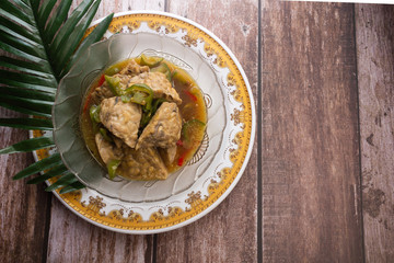 Opor Tempe is Indonesian dish consisting of tempe cooked with chili  in coconut milk from Central...