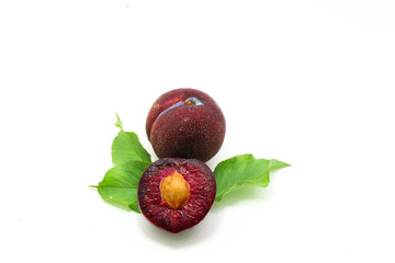 fresh plum isolated on white background closeup