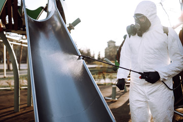 Cleaning and Disinfection the playground with spray chemicals to preventing the spread of the epidemic of coronavirus, pandemic in quarantine city. Covid-19.