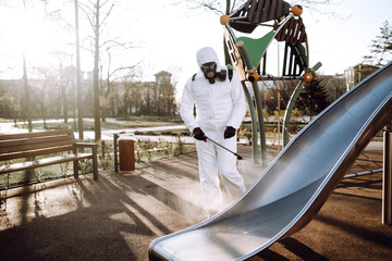 Cleaning and Disinfection the playground with spray chemicals to preventing the spread of the...
