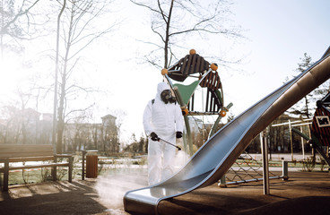 Cleaning and Disinfection the playground with spray chemicals to preventing the spread of the...