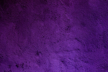 Purple colored abstract wall background with textures of different shades of purple or violet