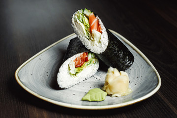 sushi set , dark background. seafood, nigiri, rolls, soy sauce, ginger,