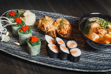 sushi set and ramen with seafood and vegetables