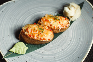 sushi set , dark background. seafood, nigiri, rolls, soy sauce, ginger,