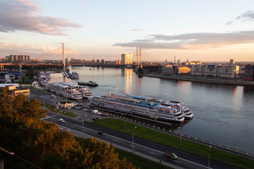 Naklejka premium sunset view of the neva river and the bridge