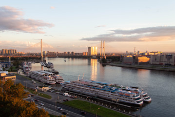 sunset view of the neva river and the bridge