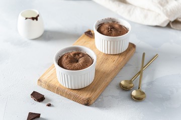 Warm Chocolate Lava Cake in ramenkins on white background. Restaurant, bakery, confectionery menu, recipe