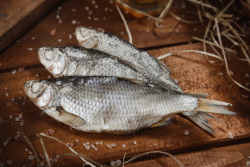 view of dried fish with salt of wooden surface delicious