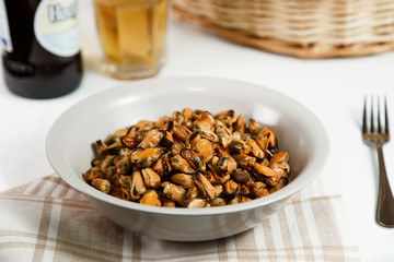 portion of roasted mussels served on table delicious