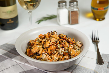 portion of roasted mussels served on table delicious