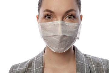 young woman on a white background in a medical mask