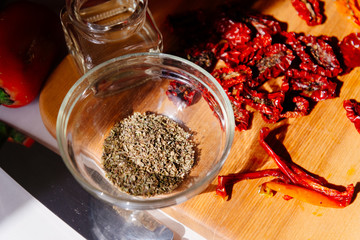 Sun-dried tomatoes and dried carrots with olive oil and Provencal herbs. The process of making dried tomatoes. Ingredients for Vegetable Chips top view