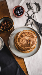Pancakes with toppings on a table