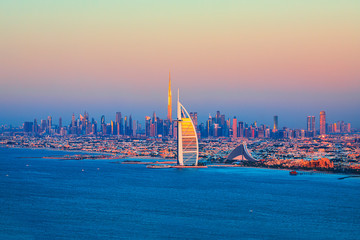 Fototapeta premium Dubai Marina, city of tourism from Palm Island at sunrise, United Arab Emirates
