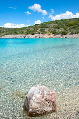 Fototapeta na wymiar Crystal clear, Caribbean-like waters of Agia Dynami beach on Chios island, Greece.
