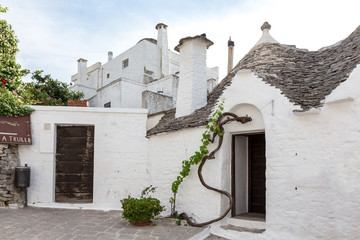 Street in Alberobello, the city of trulli. Puglia, Italy.