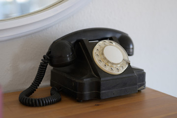 Vintage phone with rotary dial in close-up