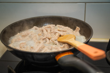 fry meat in a pan