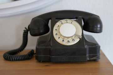Vintage phone with rotary dial in close-up