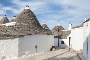 Street in Alberobello, the city of trulli. Puglia, Italy.
