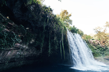 Fototapeta na wymiar Duden Waterfalls is a famous landmark of Antalya, Turkey. Upper Duden Waterfalls is located in Duden National Park. Water flowing trought the park.