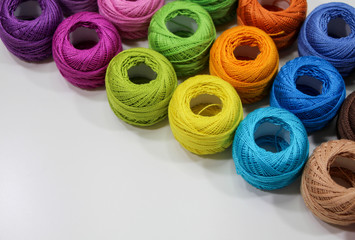 Multi-colored cotton crochet yarns. Colored threads for needlework and creativity.