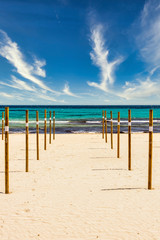 On Sa Coma on the Mediterranean island of Mallorca there are wooden poles in the beach on which the parasols are placed at the start of the season