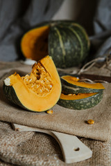 delica pumpkin in the garden. Kabocha, is Japanese pumpkin slice or green pumpkin on Grey background