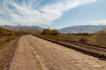 Fototapeta na wymiar A367 highway passing in the Chui region of Kyrgyzstan near the village of Kojomkul.