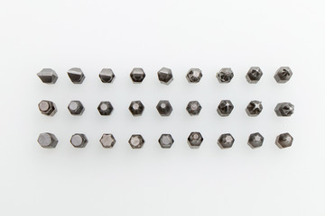 Tool kit for home and repair. Screwdriver with nozzles of different types on a white background.