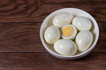 Boiled peeled eggs without shell on a plate. Ingredients for cooking.