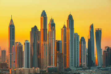 Amazing and Luxury Dubai Marina skyscrapers, famous Jumeirah beach skyscrapers at sunrise, United Arab Emirates