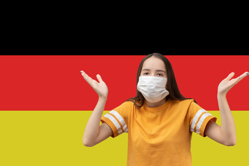 When will the coronavirus epidemic in Germany end. Girl in antibacterial medical mask makes a...