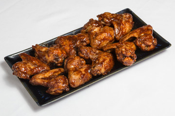 Spanish chicken wings in sauce.