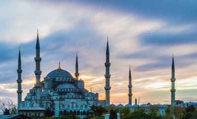 Long exposure photo of Blue Mosque at dusk in Istanbul, Turkey; with vibrant colored sky.