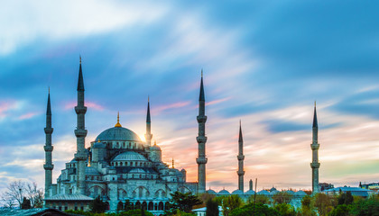 Fototapeta na wymiar Long exposure photo of Blue Mosque at dusk in Istanbul, Turkey; with vibrant colored sky.