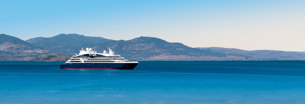 Side view of small cruise ship on the Aegean Sea. Panorama.