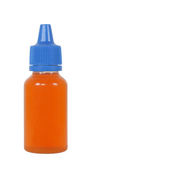 Little bottle with blue lid and dark liquid inside